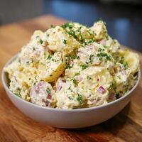Creamy Potato Salad Bursting with Fresh Herbs and Seasonings. photo