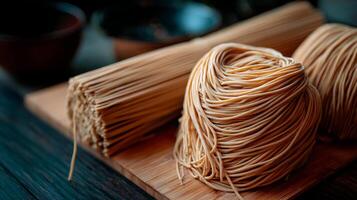 Close Up of Dry Spaghetti Bundles and Nests on a Wooden Board. photo