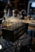 Laboratory Experiment With Glass Test Tubes and Equipment on a Reflective Surface During Evening Hours photo