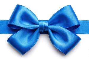 Shiny blue ribbon bow representing celebration and festivity on white background photo