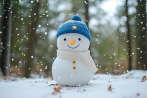 Cute snowman in a winter forest photo