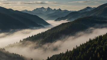 Majestic Mountain Range Overlooking a Valley Filled with Low-Lying Clouds photo