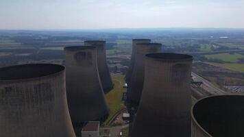 Large power generation facility with cooling towers aerial drone Nottingham England video