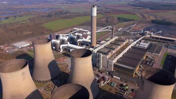 Drone footage over large power plant turbines and cooling towers Nottingham UK video