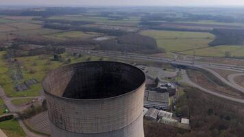 Drone aerial view of energy generation facility with cooling towers Nottingham UK video