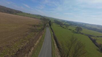 Winter spring rural landscape FPV drone fast flying near tree lines video