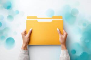 Hands carrying a vibrant document folder against a bright and colorful abstract background photo