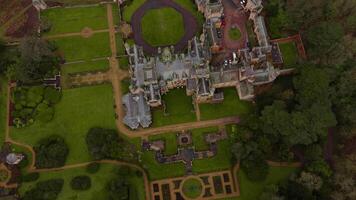 Scenic drone flyover of Harlaxton Manor architecture in rural countryside video