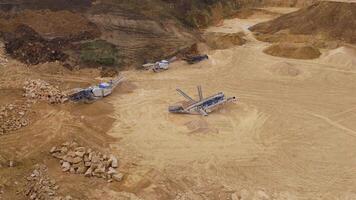 Aerial drone footage of active quarry site mining iron ore and coal in England video
