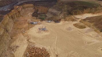 Aerial shot of heavy industrial mining at aggregate quarry site England video