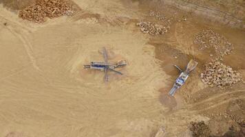 Industrial mining site with heavy equipment excavating aggregates from quarry England video
