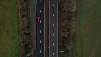 Aerial view of cars and trucks crossing busy highway junction Spring England video