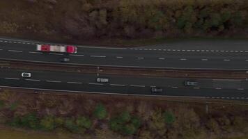 Morning highway traffic captured by aerial drone over English rural land video
