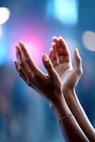Hands expressing passion during a speech with vibrant lighting in the background and ample space for text photo