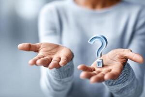 Hands holding a question mark symbolizing uncertain job responsibilities and career choices photo