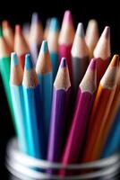 Unique arrangement of colorful pencils on a vibrant background for creative expression photo