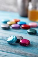 Colorful bottle caps create a cheerful vibe on blue wooden table photo