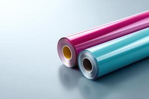 Colorful rolls of glossy vinyl film are ready for creative projects and designs in a stylish workspace photo