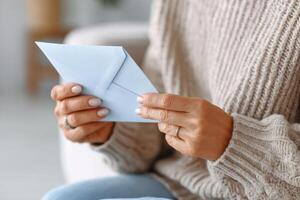 Hands holding a supportive letter in a calming environment during difficult times photo