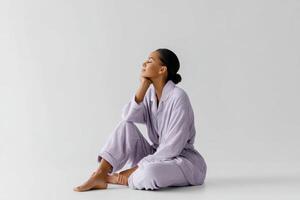 Relaxing in comfortable pajamas and robes for ultimate home pleasure on a white background photo