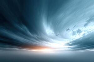 Swirling clouds create vivid patterns in the sky above an empty landscape at twilight photo