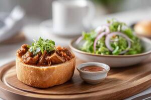 Savor spicy veggie-filled bunny chow served on a wooden platter with a fresh side salad photo