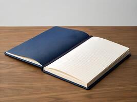Open Navy Blue Notebook on Wooden Table photo
