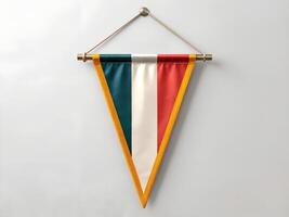 Triangular Pennant with Red White and Green Stripes Hanging on a Wall photo