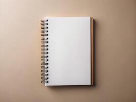 a notebook with a blank page on a beige background photo