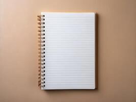 open notebook with a blank page on a beige background photo