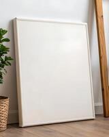 Off White Textured Canvas in White Frame Against White Wall photo