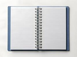 an open notebook with blank pages on a white background photo