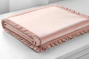 Soft Pink Plush Blanket with Ruffle Trim on White Surface photo