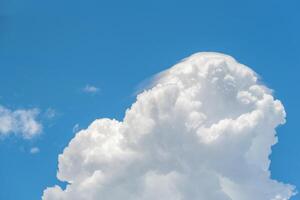 A large white cloud is in the sky photo