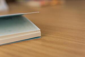 Notebook or note paper sheet retro style on table photo