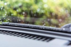 A car windshield with rain drops on it photo