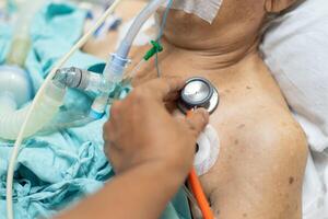 A person in a hospital bed with a stethoscope photo