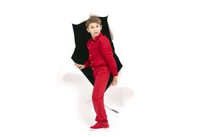 A child from a hole in paper. Cardboard show boy photo