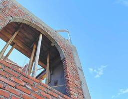 Incomplete Building Structure with Bright Sky Background photo