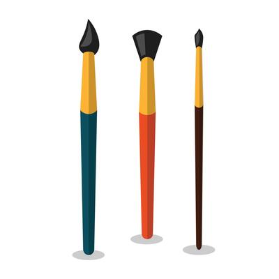 Three paint brushes on a white background