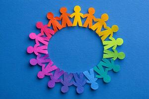 Diversity Circle of Colorful Paper People on Blue Background photo