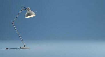A lamp on a blue background with a blue light photo