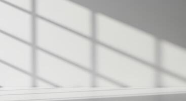 A white room with a window and a table photo