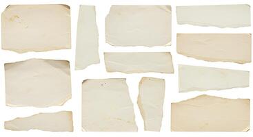 A collection of old torn paper on a white background photo
