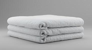 Three folded towels stacked on top of each other photo