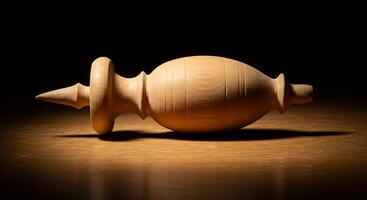 A wooden object sitting on a table photo
