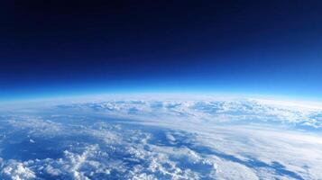 Panoramic view from high altitude showcasing the Earth's curvature, atmospheric layers and cloud formations. photo
