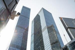 Skyline View of Modern Skyscrapers in Moscow Showcasing Glass Facades Under Bright Sunlight in the Afternoon photo