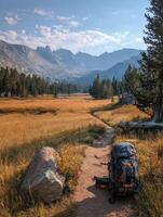 Explore the Beauty of a National Park Trail With a Backpack in the Foreground on a Sunny Day photo