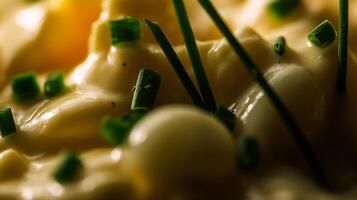 Creamy Deliciousness with Fresh Chives and Soft Yellow Hue. photo